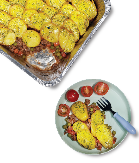 A tray and a plate with stew and potatoes, nursery lunch